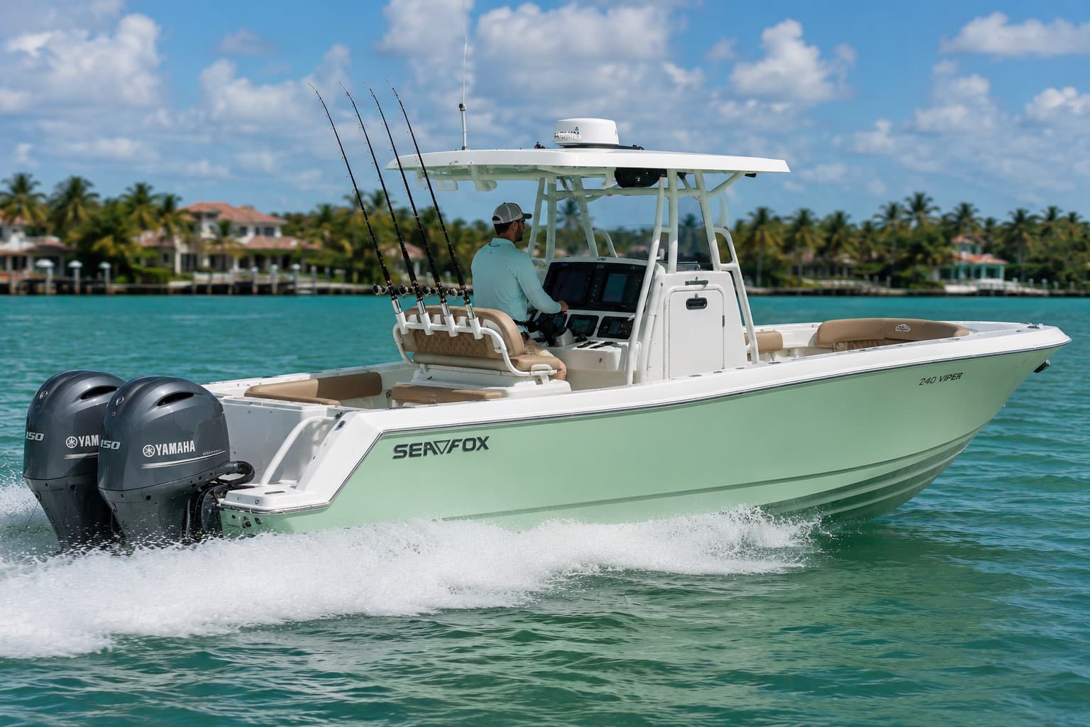 The club's 24' Sea Fox center-console boat with twin Yamaha outboards and tan upholstered seating running along a palm-lined shoreline.