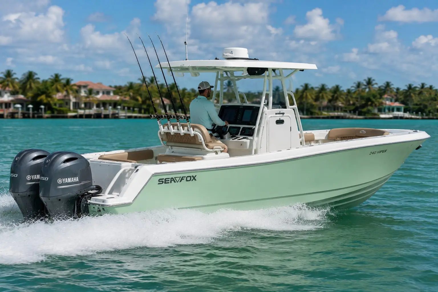 The club's 24' Sea Fox center-console boat with twin Yamaha outboards and tan upholstered seating running along a palm-lined shoreline.